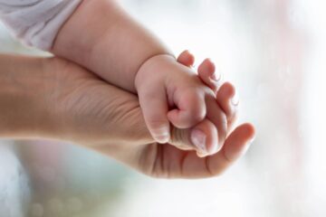 Parent and child holding hands